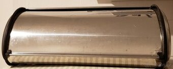 Chlebník. Jako nový, nerezový, s rolovacími dvířky.