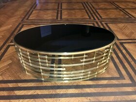 Oválný stolek - zlatý kov s černým lesklým sklem