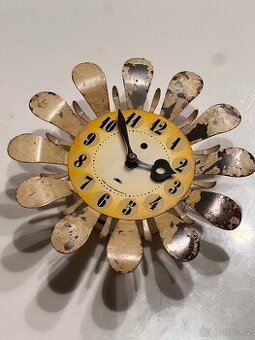 Kovové hodiny Prim “Květina” / Sunburst