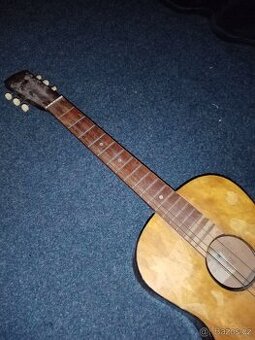 děcka kytara má dobrý zvuk. cena 200,kč