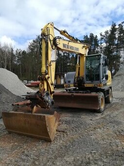 Prodám kolový bagr New Holland MH 5.6, 20,5 t, r.v. 2009, 8.