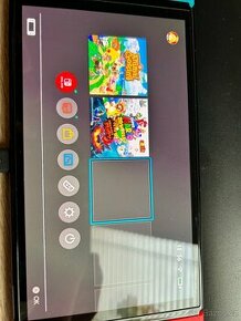 Nintendo Switch OLED s příslušenstvím + 2 hry