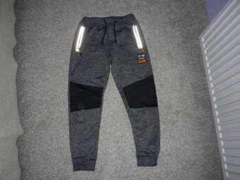 Vyteplené sportovní kalhoty Kugo vel 140-146