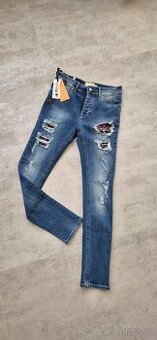 Elegantní trhané džíny Met