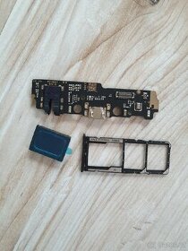 Zadní kryt, mikrofon,nabíjecí deska,slot SIM Xiaomi Redmi A1