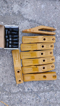 čelní zuby pro stroje CAT/ New Holland / FIAT KOBELCO