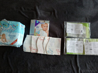 Prodám podložky 8ks+bryndáky 5ks+sterilizační sáčky 3ks