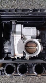 Škrtící klapka Nissan Mikra 1.2 59kW