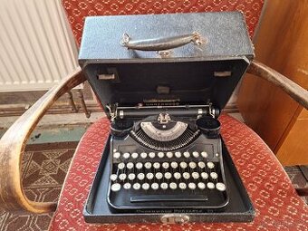 Starožitný, kufříkový, psací stroj.
