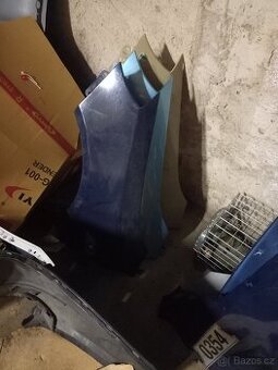 Škoda Fabia 2 roomster levý blatník použitý na lak
