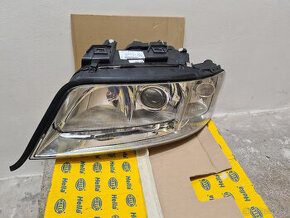 Audi A6 97-01 Xenon Hella světlo levé nové