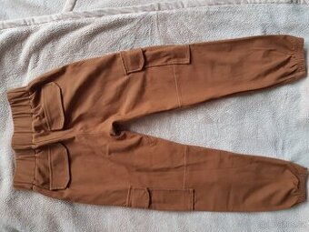 Skořicové kalhoty/kapsáče zn. Šijeme srdcem 122/128