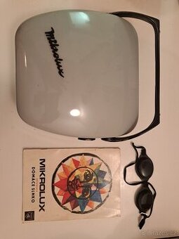 Přenosný kombinovaný zářič (UV a IR) pro domácí fototerapii.