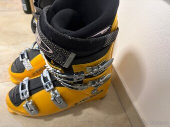 Lyže Salomon, boty Head,helmy Rossignol