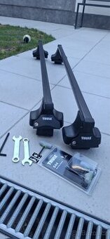 Prodám nosiče na auto značky Thule