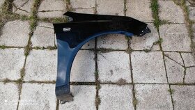 Pravý přední blatník Opel Corsa D - černý