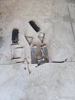 Chladiče,hadice a držáky Husqvarna 125