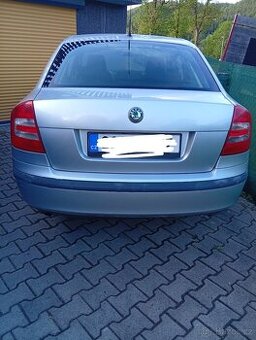 Prodám komplet zadní páté dveře ,vrata na škoda Octavia 2