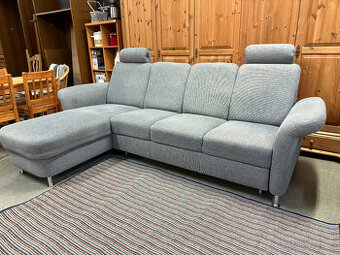 Rohová rozkládací šedá sedačka 260 x 160cm