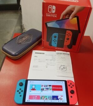 Nintendo Switch OLED záruka 12/2025 Electroworld + pouzdro