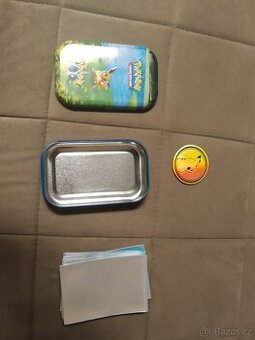 Prodám pokémon krabička s obalami na karty a mincí