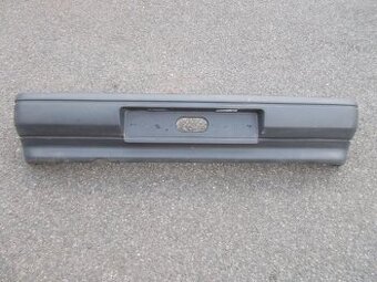7700795083 Zadní nárazník Renault Clio I černý nelakovaný