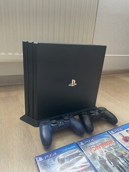 PS4 Pro + dva ovladače + 6 her + stojan