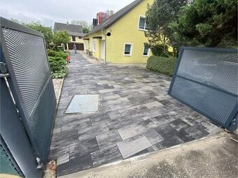 Pokládka venkovní dlažby a montáž betonových plotů
