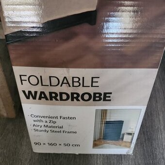 Skládací skříň textil -Nerozbalená