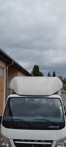Větrný štít , kšilt , spojler na kabinu. - 1