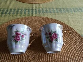 Dva porcelánové hrníčky - šálky, zlacené