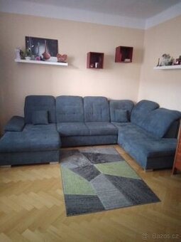 Sedací souprava tvaru U - rozkládací s úložným prostorem