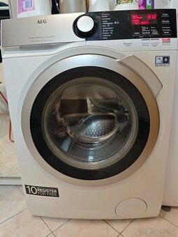 AEG parní A+++, 7kg, 1400ot.Fuzzy Logic,XXL otvor