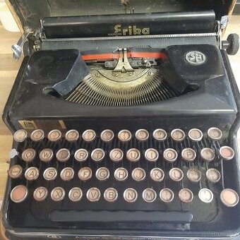 Kufříkový psací stroj