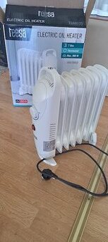 El. olejový radiátor NOVÝ, v záruce, malá spotřeba 800W