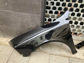 Levý i pravý přední blatník Škoda Octavia 2, barva 9910