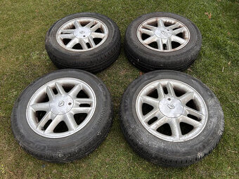 Alu kola 186/65xR15T s let. pneu Bravuris 5