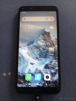 Mobilní telefon červený redmi 7A