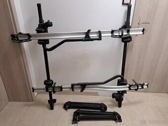 Dva střešní nosiče Thule ProRide 591 pro kola + nosiče lyží