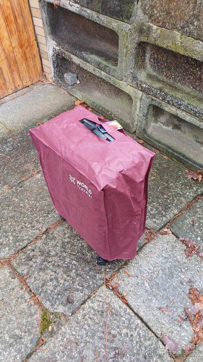 Prodám nový ochranný obal na kufr,vel.26 - 2