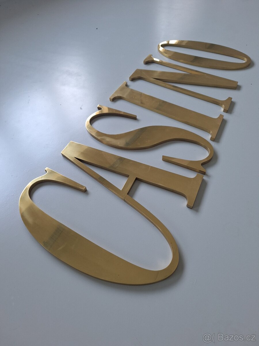 Nápis CASINO z mosazi - 2