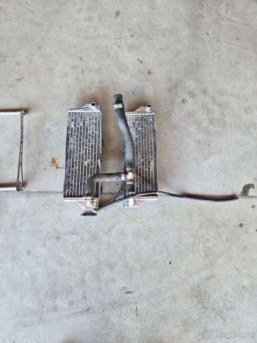 Chladiče,hadice a držáky Husqvarna 125