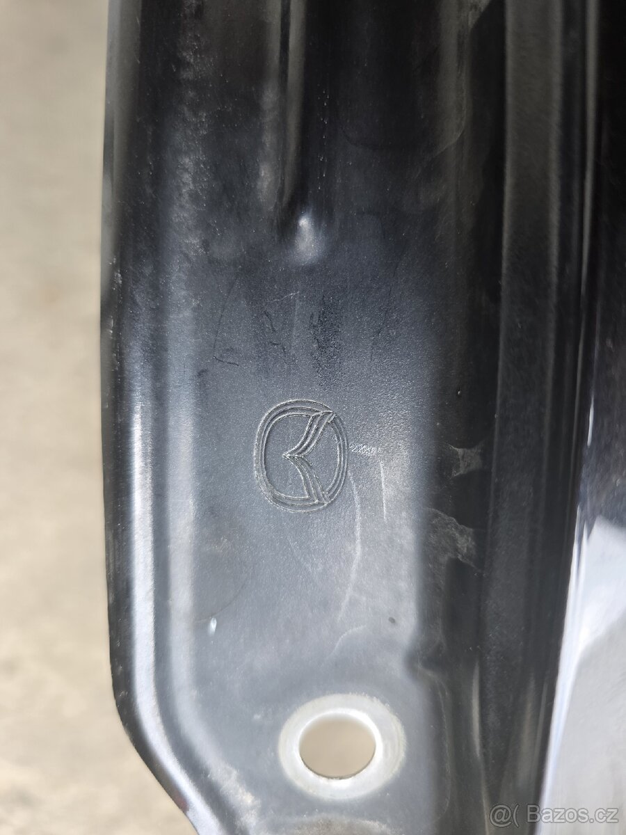 Mazda 3 (BL) - levý přední blatník - 2