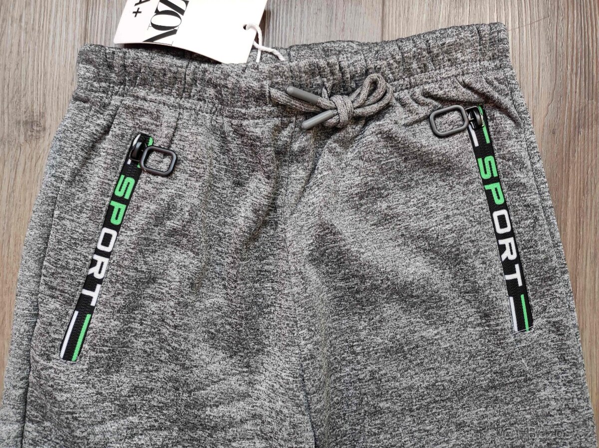 Softshellové zateplené tepláky nové - 2