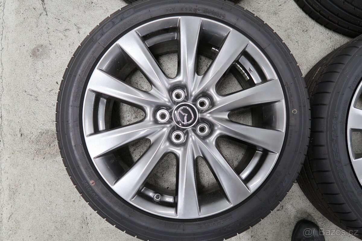 Letní komplet kola originál pro Mazda 3, pneu 215/45 R18 - 2