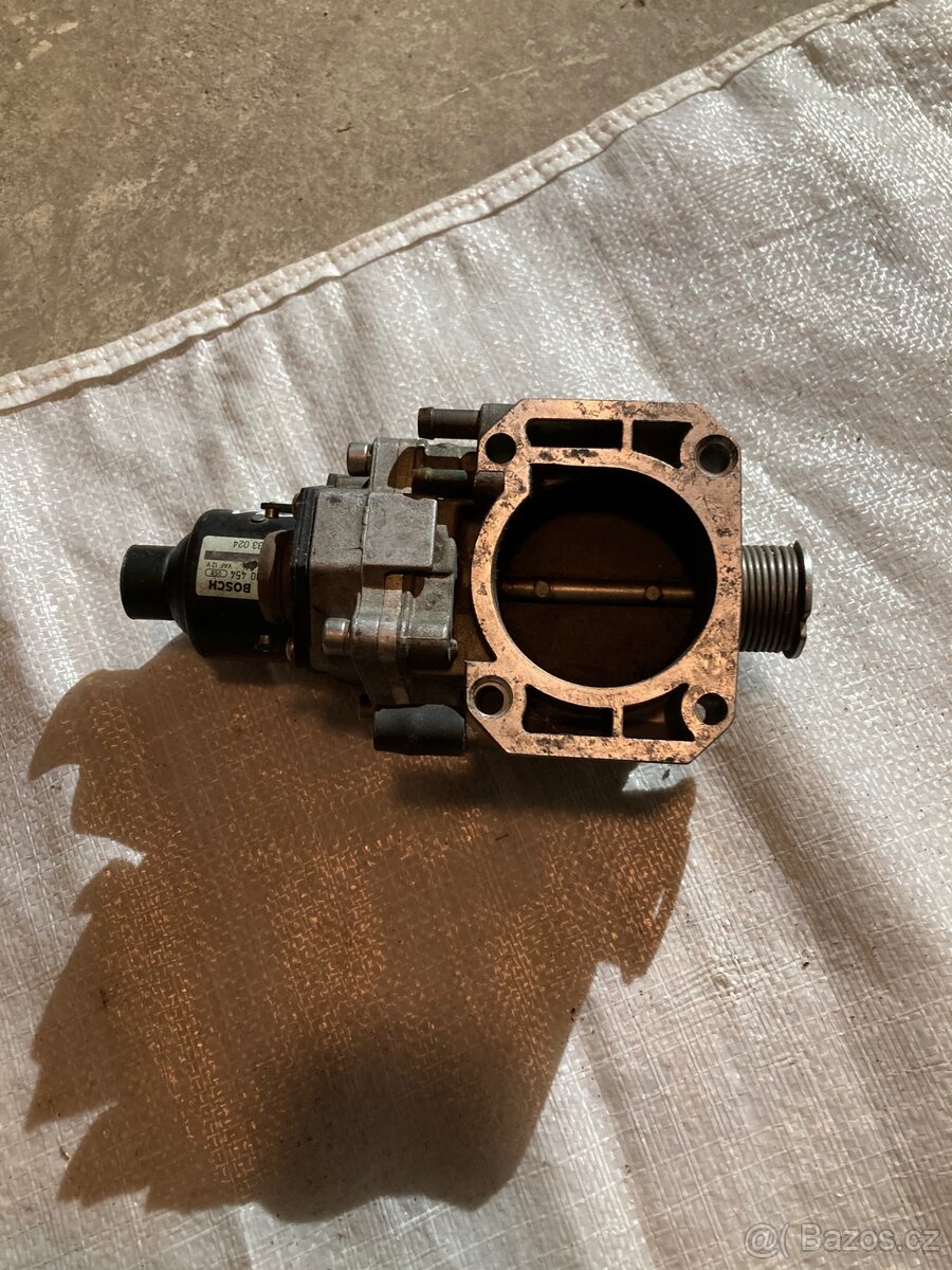 Škrtící klapka - BMW e31 850i - 2