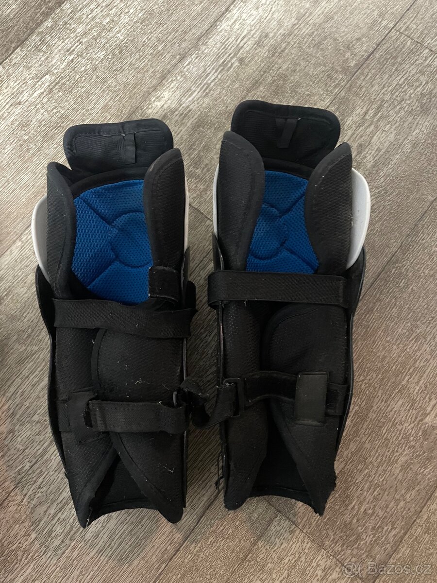 Chrániče holeni Bauer 10” 25cm - 2