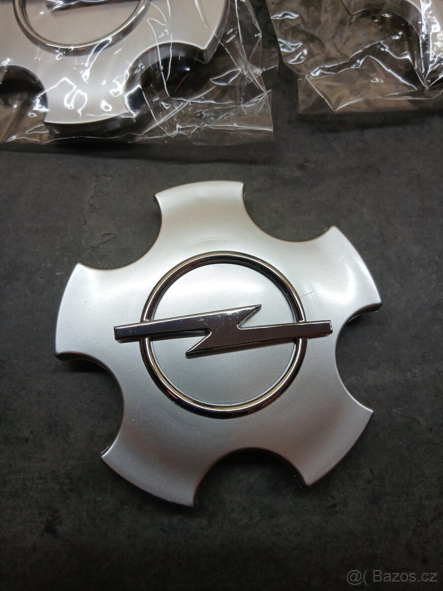 Poklice. Středová krytka kola 90468692, Opel - 2
