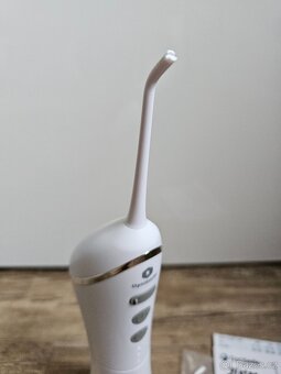 PRODÁM MÁLO POUŽITOU ÚSTNÍ SPRCHU OPTISMILE V ZÁRUCE - 2