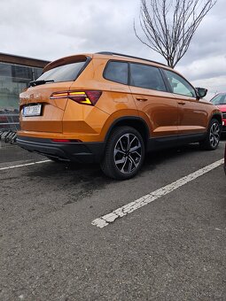 Roční Škoda Karoq 1.5 TSi Orange 8./24 - 2